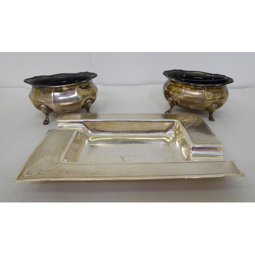 159 - A silver ashtray; and a pair of silver salts  mixed marks