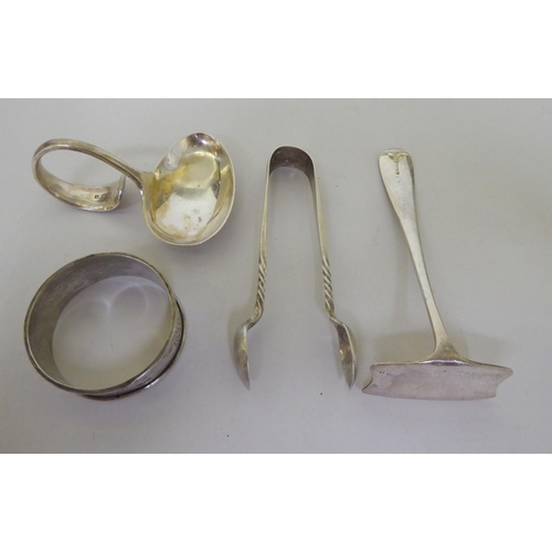 164 - Silver collectables: to include flatware; a mug; a cigarette case; and a spoon and pusher  mixe... 