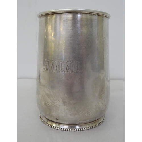 164 - Silver collectables: to include flatware; a mug; a cigarette case; and a spoon and pusher  mixe... 