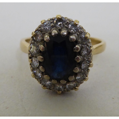 172 - An 18ct gold diamond and sapphire cluster ring