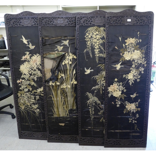 178 - An early 20thC fruitwood framed fourfold room screen with embroidered panels  each panel 66