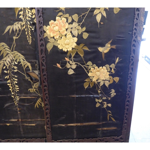 178 - An early 20thC fruitwood framed fourfold room screen with embroidered panels  each panel 66