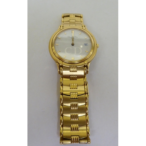 187 - A Christian Dior gold plated Quartz bracelet watch, faced by a baton dial