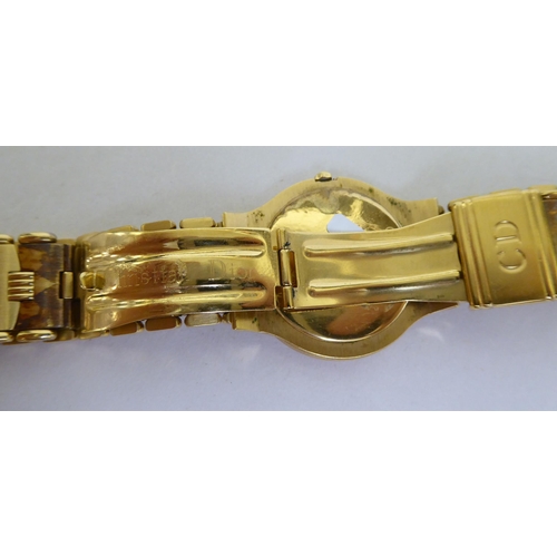 187 - A Christian Dior gold plated Quartz bracelet watch, faced by a baton dial