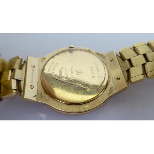 187 - A Christian Dior gold plated Quartz bracelet watch, faced by a baton dial