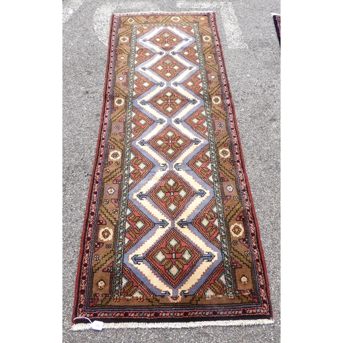 199 - A Persian runner, decorated with repeating diamond forms, on a multi-coloured ground  31