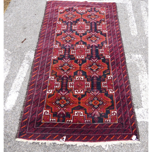 244 - A Persian rug, on a red ground  41