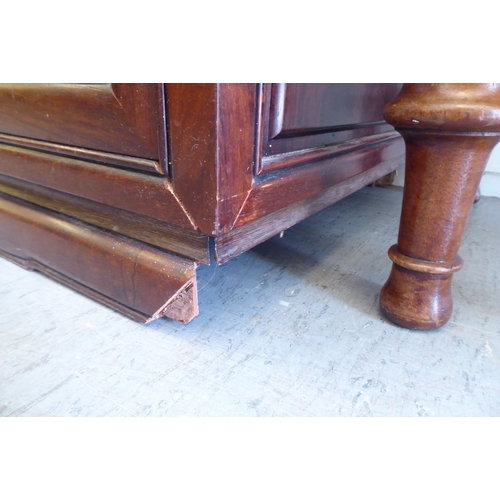 245 - A 20thC Chinese fruitwood dresser with four in-line drawers, over four panelled doors, raised on sha... 