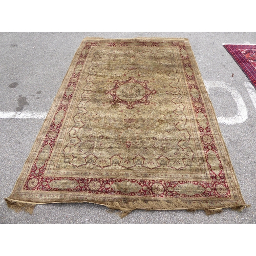 248 - A Persian partial silk woven rug, on a cream coloured ground  72