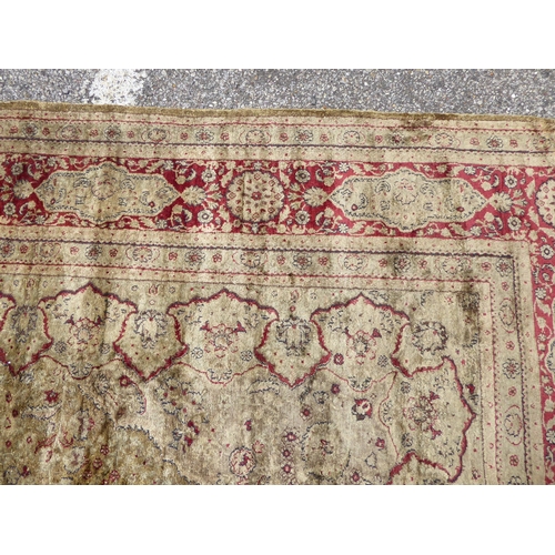 248 - A Persian partial silk woven rug, on a cream coloured ground  72