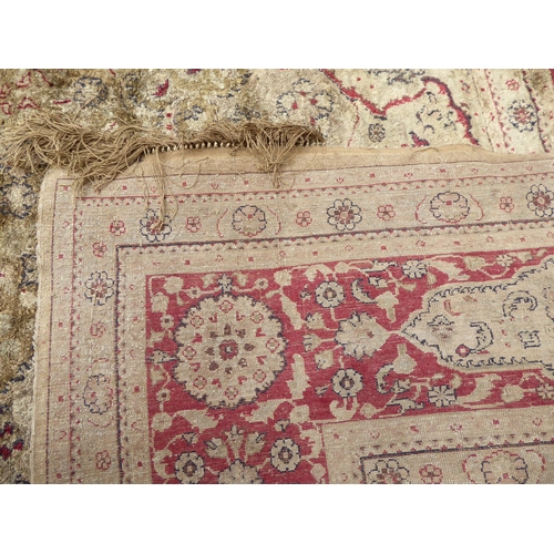 248 - A Persian partial silk woven rug, on a cream coloured ground  72