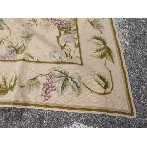 255 - A tapestry panel, decorated with flora, in pastel colours, on a cream ground  108