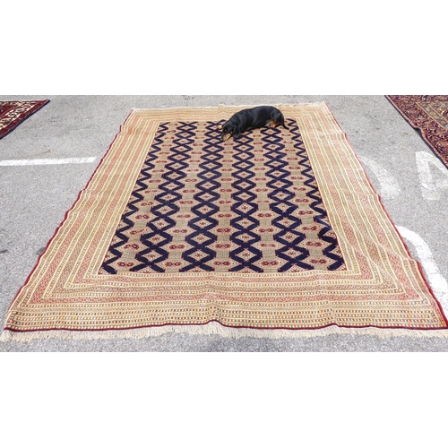 256 - A Bokhara carpet, on a mainly cream coloured ground  88