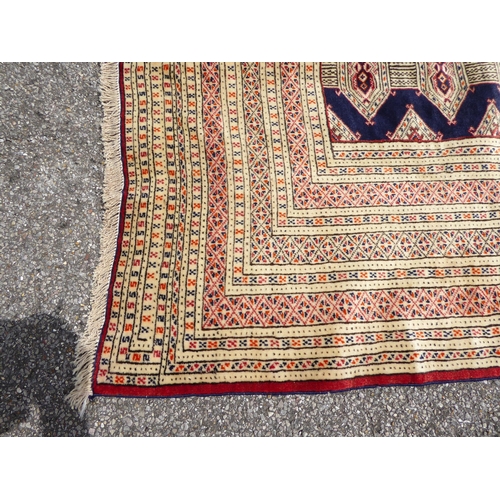 256 - A Bokhara carpet, on a mainly cream coloured ground  88