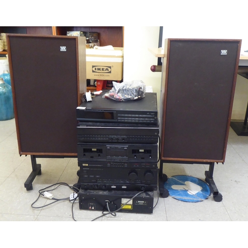 259 - A Kenwood five piece stacking stereo system; and a pair of teak cased Wharfdale speakers  32