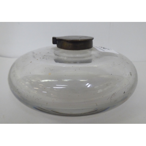 266 - A 19thC glass inkwell of squat, circular form with a hinged brass cap  5