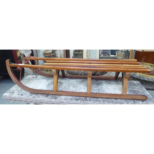 275 - A Dados of Germany beech sledge with cast iron supports  44