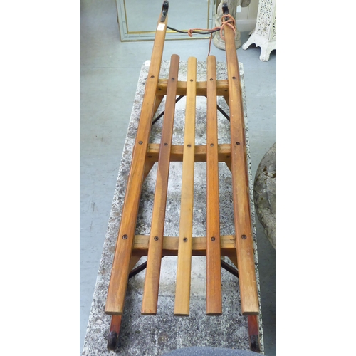 275 - A Dados of Germany beech sledge with cast iron supports  44