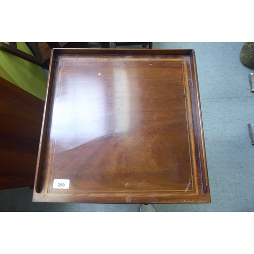 290 - An Edwardian mahogany pot cupboard with a low gallery, over a door and drawer, raised on square legs... 