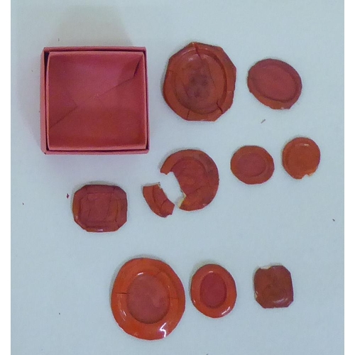 292 - A collection of fifteen boards, containing mainly 19thC variously impressed red and other wax seals