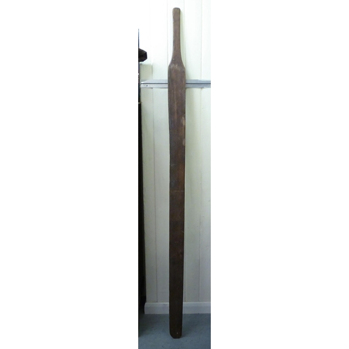 3 - A 20thC teak one-piece paddle/oar  84