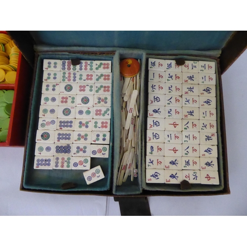 31 - Table games: to include a Mah Jong set, in a stitched brown hide case; and a Bakelite roulette wheel