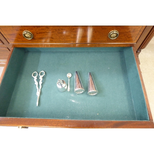 317 - A modern mahogany finished canteen cabinet containing Kings pattern cutlery and flatware, raised on ... 