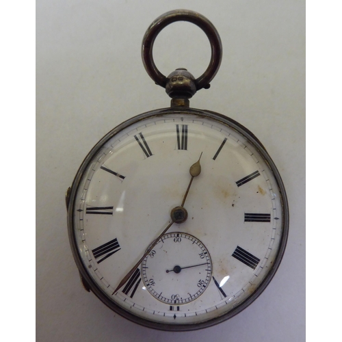 34 - A late Victorian silver cased pocket watch, faced by a white enamel Roman dial, on a silver curb lin... 