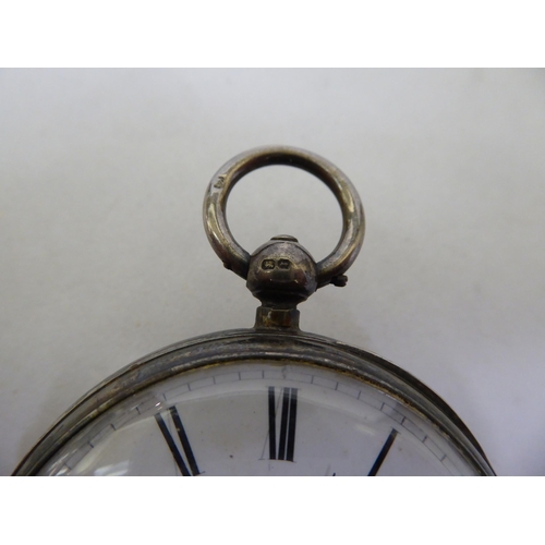 34 - A late Victorian silver cased pocket watch, faced by a white enamel Roman dial, on a silver curb lin... 