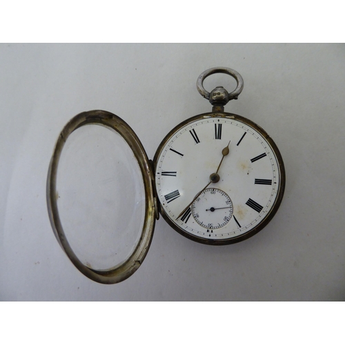 34 - A late Victorian silver cased pocket watch, faced by a white enamel Roman dial, on a silver curb lin... 