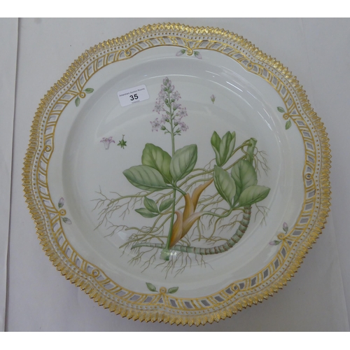 35 - A Royal Copenhagen porcelain Flora Danica pattern plate with a pierced, wavy edge, decorated with Me... 