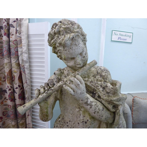 43 - A composition stone classical nude, playing a pipe, standing beside a pillar, on a square plinth&nbs... 