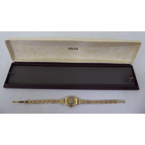 49 - A lady's Avia 9ct gold cased, open chain link bracelet wristwatch, faced by an Arabic dial  cased