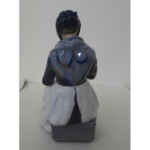 5 - A Royal Copenhagen porcelain figure, a woman knitting  No.1317  7