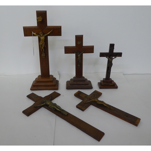 52 - Five similar crucifixes with cast metal Corpus Christi, on wooden stands  largest 16