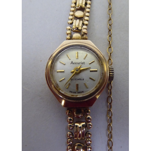 54 - A lady's Accurist 9ct gold cased, fancy link bracelet wristwatch, faced by a baton dial  cased