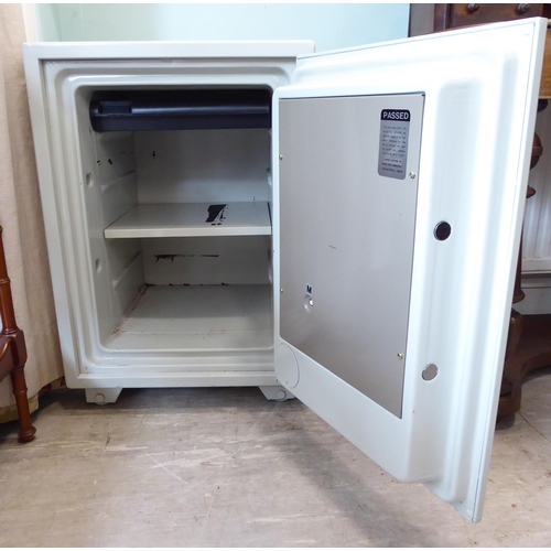 63 - A Royal Safe, in off white enamel with a full height door and key operated lock  26