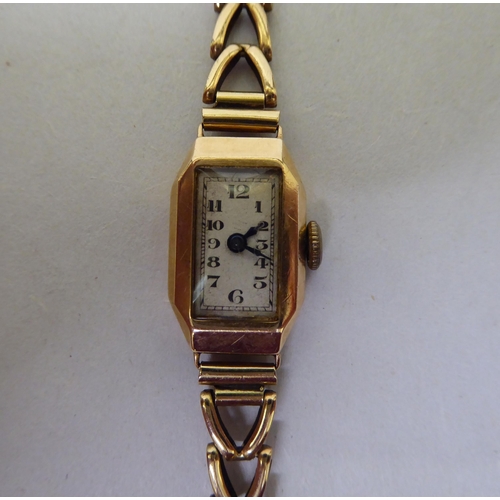 64 - A lady's Art Deco 9ct gold cased, fancy chain link bracelet wristwatch, faced by an Arabic dial