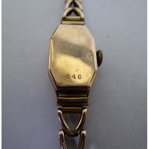 64 - A lady's Art Deco 9ct gold cased, fancy chain link bracelet wristwatch, faced by an Arabic dial