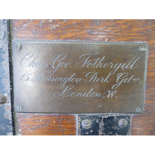 66 - A late Victorian Army & Navy oak silver chest with wrought metal strapwork and a hinged lid, enc... 