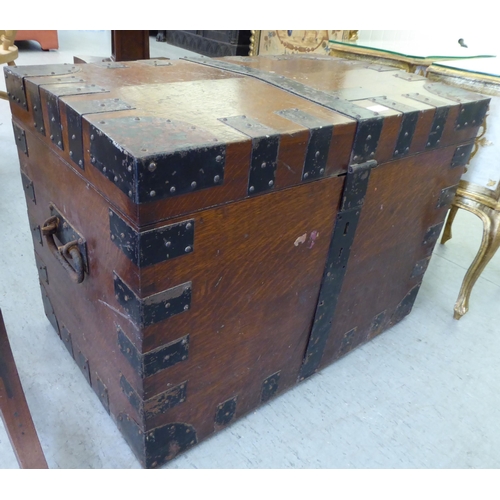 66 - A late Victorian Army & Navy oak silver chest with wrought metal strapwork and a hinged lid, enc... 