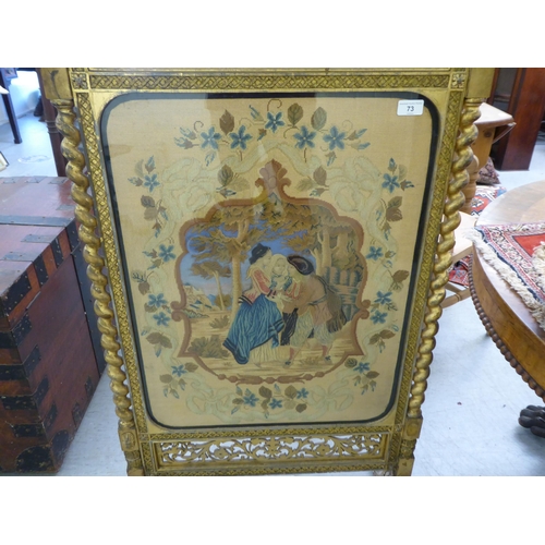 73 - A mid Victorian gilt gesso framed firescreen, set with a tapestry panel, depicting figures, raised o... 