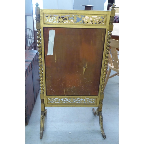 73 - A mid Victorian gilt gesso framed firescreen, set with a tapestry panel, depicting figures, raised o... 