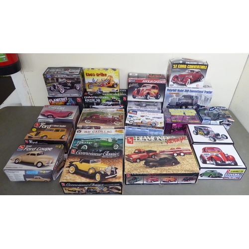 96 - 1/25 scale model kits: to include by AMT, a 1940 Ford Coupe; and a Jeep Wrangler Rubicon by Revell&n... 