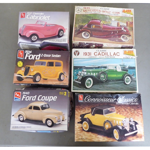 96 - 1/25 scale model kits: to include by AMT, a 1940 Ford Coupe; and a Jeep Wrangler Rubicon by Revell&n... 