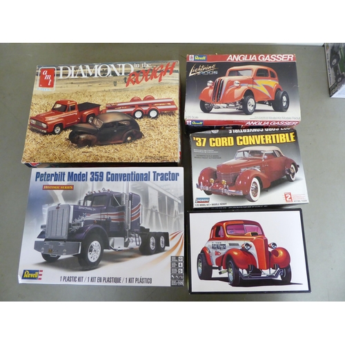 96 - 1/25 scale model kits: to include by AMT, a 1940 Ford Coupe; and a Jeep Wrangler Rubicon by Revell&n... 