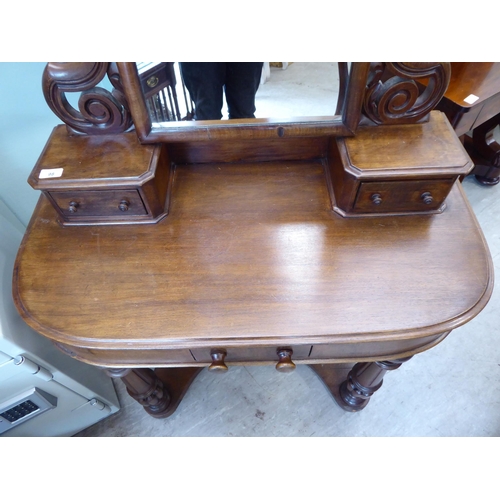 98 - A modern Victorian style Duchess style mahogany dressing table, surmounted by a swing mirror and a p... 