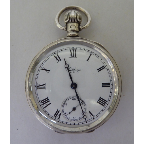 99 - An early 20thC Waltham silver cased pocket watch, the keyless movement faced by a Roman dial, incorp... 