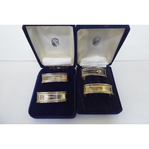 257 - Collectables: to include two pairs of silver presentation napkin rings  mixed marks  boxed