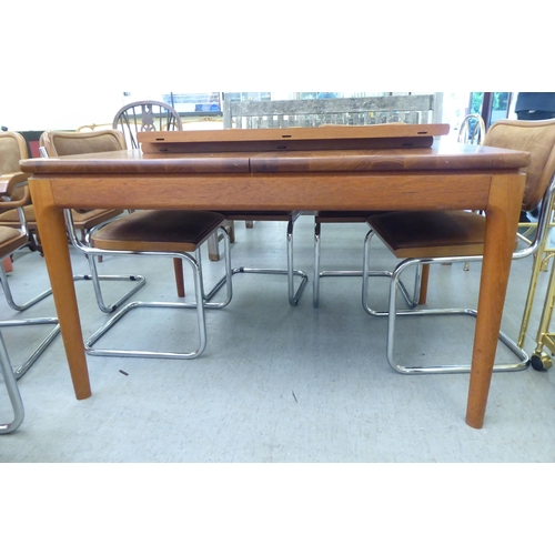 291 - A Heal & Son Ltd teak dining table, raised on turned, straight, tapered legs  29